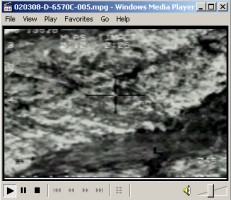 Video showing a flight of F-15s dropping numerous bombs on al Qaeda fighting positions and striking on March 7, 2002, enemy forces dug in on the side of a hill