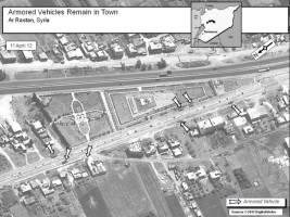 Armored vehicles remain in Ar Rastan, Syria, 11 April 2012.