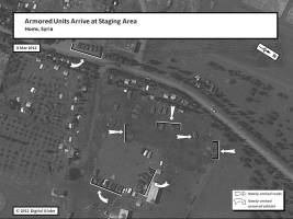 This graphic shows newly arrived tanks and armored vehicles at a military staging area outside Homs on 8 March 2012, after the drawdown of security operations in Homs.