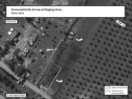 This graphic shows newly arrived tanks and armored vehicles at a military staging area outside Homs on 8 March 2012, after the drawdown of security operations in Homs.