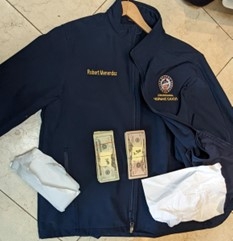 Picture of jacket bearing Menendez's name with money on top of it