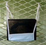 A Koran hangs in a surgical mask in Camp 1, Camp Delta, Naval Station Guantanamo Bay, Cuba