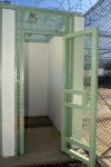 A single, outside shower stall adjacent to the recreation/exercise area at Camp Delta