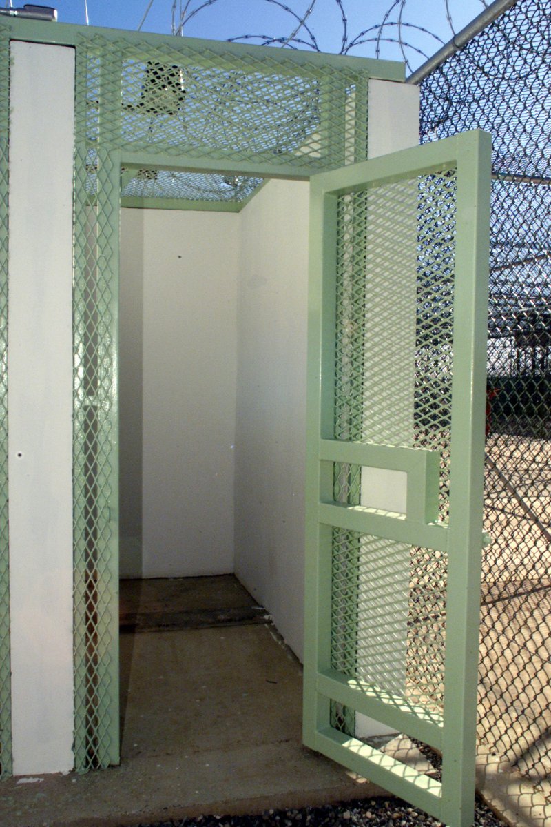 A single, outside shower stall adjacent to the recreation/exercise area at Camp Delta, Guantanamo Bay, Cuba