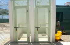 Cell blocks in Camp Delta, Naval Station Guantanamo Bay, Cuba, have two shower stalls outside the end of the block