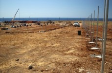 Construction workers lay support foundations for the new detention facility at Camp Delta