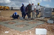 Construction workers lay support foundations for the new detention facility at Camp Delta