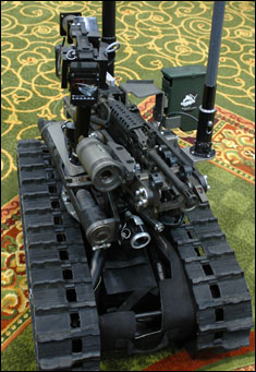 With a weapons platform mounted to a Talon robot, the SWORDS system allows Soldiers to fire small arms weapons by remote control from as far as 1,000 meters away. The system, demonstrated this week at the bienniel Army Science Conference, may soon join Soldiers in Iraq.