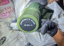 Photo of a U.S. service member holding a proximity fuse seized from a fishing trawler interdicted by expeditionary sea base USS Lewis B. Puller, Dec. 1, in the Gulf of Oman. Forces from Lewis B. Puller found more than 1 million rounds of 7.62mm ammunition; 25,000 rounds of 12.7mm ammunition; nearly 7,000 proximity fuses for rockets; and over 2,100 kilograms of propellant used to launch rocket propelled grenades. (NAVCENT Public Affairs)