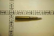 Photo taken Dec. 3 of an individual round of 12.7mm ammunition seized from a fishing trawler interdicted by expeditionary sea base USS Lewis B. Puller, Dec. 1, in the Gulf of Oman. Forces from Lewis B. Puller found more than 1 million rounds of 7.62mm ammunition; 25,000 rounds of 12.7mm ammunition; nearly 7,000 proximity fuses for rockets; and over 2,100 kilograms of propellant used to launch rocket propelled grenades. (NAVCENT Public Affairs)