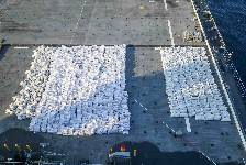 Bags containing more than 50 tons of fuses and propellants for rockets and ammunition rounds sit on the flight deck of expeditionary sea base USS Lewis B. Puller (ESB 3), Dec. 3. Forces from Lewis B. Puller seized from a fishing trawler more than 1 million rounds of 7.62mm ammunition; 25,000 rounds of 12.7mm ammunition; nearly 7,000 proximity fuses for rockets; and over 2,100 kilograms of propellant used to launch rocket propelled grenades. (NAVCENT Public Affairs)