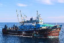 A stateless fishing trawler intercepted by Navy personnel operating from expeditionary sea base USS Lewis B. Puller (ESB 3) transits the Gulf of Oman Dec. 3. Forces from Lewis B. Puller found more than 1 million rounds of 7.62mm ammunition; 25,000 rounds of 12.7mm ammunition; nearly 7,000 proximity fuses for rockets; and over 2,100 kilograms of propellant used to launch rocket propelled grenades. (NAVCENT Public Affairs)