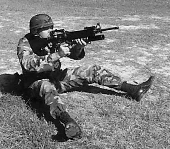 Figure 5-5. Sitting position, open-legged, quadrant sight.