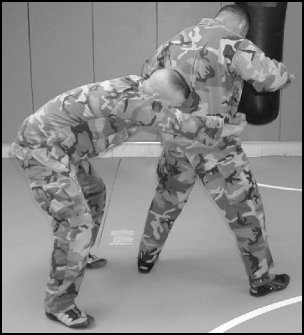 Figure 5-16. Rear takedown, step 1.