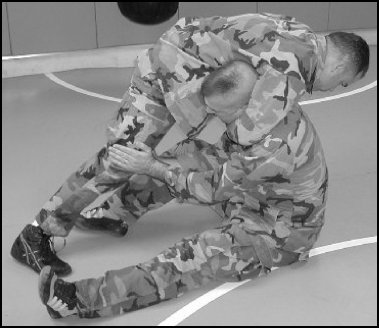 Figure 5-23. Defend the guillotine with knee strikes, step 2.