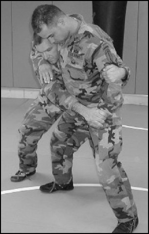 Figure 5-25. Headlock with punches, step 1.