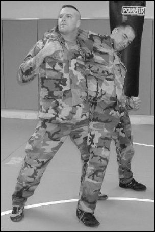 Figure 5-26. Headlock with punches, step 2.