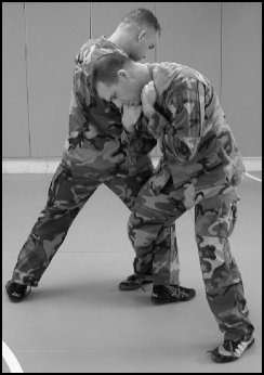 Figure 8-2. Defense against the standing rear naked choke leaning back (continued).