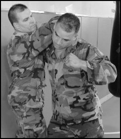 Figure 8-3. Defense against one-hand neck press against a wall (continued).