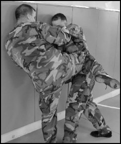 Figure 8-4. Defense against the two-hand neck press against a wall (continued).