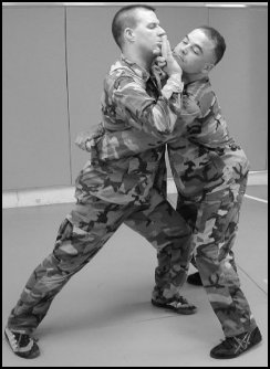 Figure 8-6. Defense against the front bear hug under your arms.