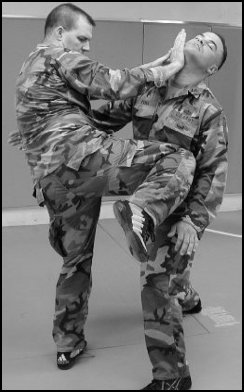 Figure 8-6. Defense against the front bear hug under your arms (continued).