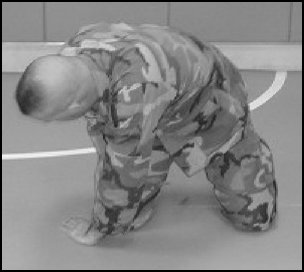 Figure 5-2. Forward rolling breakfall from the kneeling position, step 1 (continued).