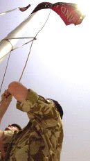The flag of the new Multi-National Division (South East) is raised at its Basrah headquarters