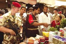 Joint patrol in Basrah by a Royal Military Policeman and an Iraqi policeman