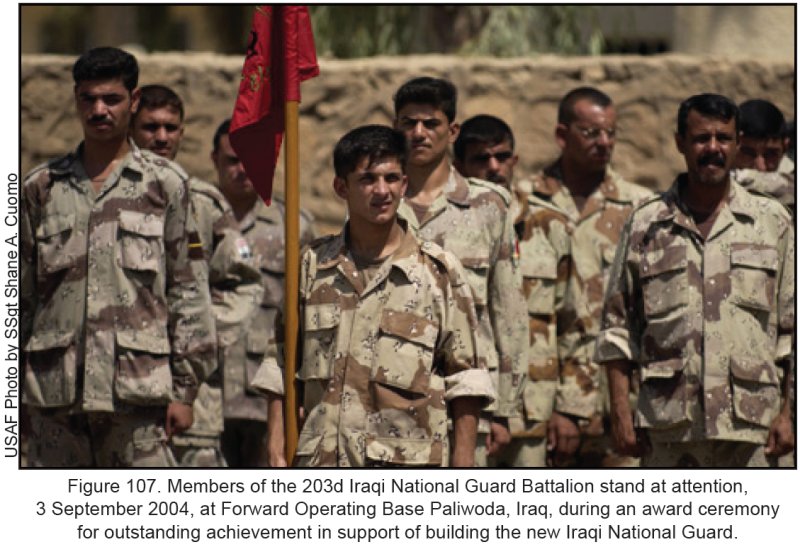 Figure 107. Members of the 203d Iraqi National Guard Battalion stand at attention 3 September 2004, at Forward Operating Base Paliwoda, Iraq, during an award ceremony for outstanding achievement in support of building the new Iraqi National Guard.