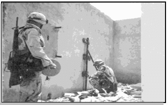 Photo of engineers preparing to breach a wall
