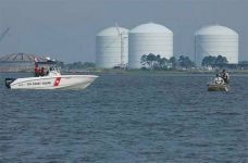 Photo of U.S. Coast Guard boat and a Georgia Department of Natural Resource boat patrol the east side of Elba Island