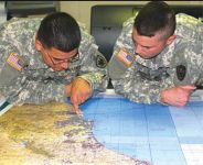 Photo showing Soldiers inspecting a map
