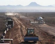 Photos showing Seabees from Naval Mobile Construction Battalion 24 on a conctruction project