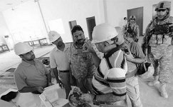 Iraqi supervisors and PRT members oversee construction of engineering college in Kut, Iraq. Photo by U.S. Air Force (Thomas A. Coney