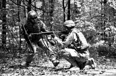 U.S. Army Soldiers from 52d Signal Battalion, Patch Barracks, Vaihingen, Germany, practice small-unit tactics during a Warrior Training exercise, near Baden Wuttemburg, Germany, 5 May 2009