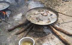 Photo showing cooking fire with sticks
