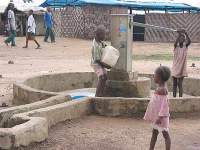 Photo showing children retrieving water