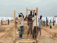 Photo showing displaced persons conducting personal and household hygiene
