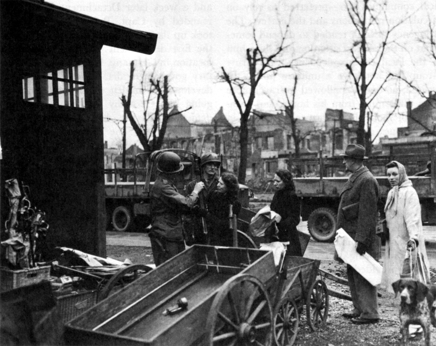 CIVILIANS TURN IN WEAPONS AND CAMERAS