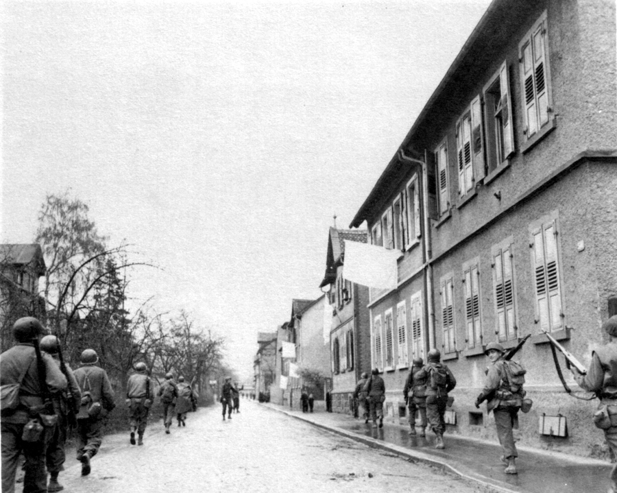 TROOPS ADVANCE: THROUGH SURRENDERED TOWN