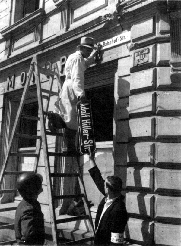 AN ERA PASSES as Germans exchange street signs.