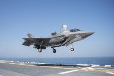 An F-35B Lighting II lands on the flight deck of the amphibious assault ship USS Wasp (LHD 1)