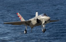 An F-35C Lightning II carrier variant joint strike fighters makes an arrested landing aboard the aircraft carrier USS Nimitz (CVN 68
