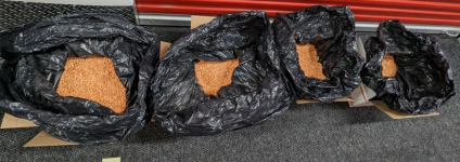 Trash bags full of counterfeit Adderall pills laced with methamphetamine.