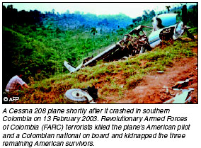A Cessna 208 plane shortly after it crashed in southern Colombia on 13 February 2003.  Revolutionary Armed Forces of Colombia terrorists killed the planes American pilot. [AFP photo]