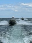 Twin Unmanned Surface Vessels  drive in a open body of water.