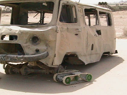   The Packbot searches for booby traps on this truck on Najaf airfield, March 31.
