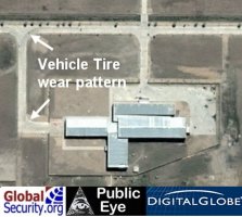 The horizontal assembly/checkout building showing rubber tire wear from vehicles